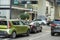 Miami street traffic with driving cars at urban intersection in Florida