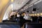 MIAMI, USA - APRIL 26, 2020: Covid 19 coronaviruse. Stewardess in protective mask on the plane board. Evacuation