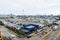 Miami, USA - November 22, 2015: maritime port or terminal with cargo container stacks, trucks on cloudy sky. Shipping, deliver, lo