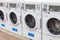 Miami, USA - September 09, 2019: industrial washing machines in a public laundromat, coin laundry service