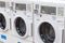 Miami, USA - September 09, 2019: industrial washing machines in a public laundromat, coin laundry service