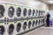 Miami, USA - September 09, 2019: industrial washing machines in a public laundromat, coin laundry service