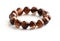 Mica rutilated quartz bracelet on white background.  Brown crystal bracelet gemstones.