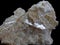 Mica sample isolated on black background. Natural Mineral Rock Specimen - mica stone. Mineral of volcanic origin