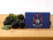 Michigan flag on a wooden panel with blackberries isolated on a