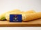 Michigan flag on a wooden panel with corn isolated on a white ba