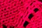Micro close up of pink wooly crochet fabric with copy space