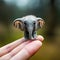 Micro Marvel: Tiny Elephant Perched on Finger - Generative AI Macro Shot