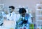 Microbiologist biotechnology researcher look microscope in the lab