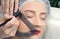 Microblading. Permanent makeup. Attractive woman getting facial care and tattoo