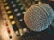 Microphone on amplifier equipment and out of focus background.: