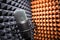 microphone in focus with blurred out soundproof foam background