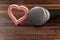 Microphone and heart on wooden background.