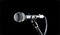 Microphone, mic, karaoke, concert, voice music. Closeup microphone. Vocal audio mic on a bleck background. Live music