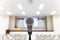 Microphone over the blurred business forum Meeting or Conference Training Learning Coaching Room Concept.