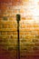 microphone ready on stage against a brick wall ready for the Karaoke performer