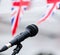 Microphone and union jack bunting at one of the concert stands at Garth Park, Bicester