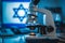 Microscope against the background of the Israel flag