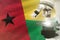 Microscope on Guinea flag background - science development concept. Research in medicine or nanotechnology 3D illustration of
