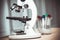 Microscope with tube of micro biological for scientist biochemist or microbiologist working research