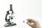 Microscope on white background and  bacteria virus