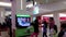 Microsoft staff demonstrates with children dance game at the mall