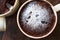 Microwave Brownie Chocolate Mug Cake with Powder Sugar on Dark Wooden Surface.