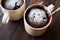 Microwave Brownie Chocolate Mug Cake with Powder Sugar on Dark Wooden Surface.