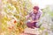 Mid adult man harvesting tomatoes at farm