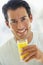 Mid Adult Man Smiling Drinking Orange Juice