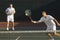 Mid Adult Men Playing Tennis