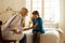 Mid-adult physician showing a tablet to a sweet small girl