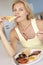 Mid Adult Woman Eating Unhealthy Fried Breakfast