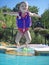 Mid-Air Toddler Having Fun at the Pool