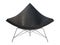 Mid-century black leather chair with white plastic base. 3d render