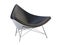 Mid-century black leather chair with white plastic base. 3d render