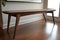 mid-century modern bench, with sleek curved lines and durable finish