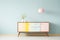 Mid-century modern buffet decorates a retro dining room in muted pastel colors