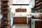 mid-century modern kitchen, with sleek and clean lines, open shelving, and an assortment of chef tools