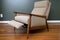 mid-century modern recliner, with plush and cozy upholstery, in comfortable and inviting environment