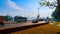 Mid-day view of main road along well-known Mandovi river, local people and transportation