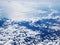 Mid-level cloudscape altocumulus white clouds. Altocumulus middle-altitude cloud in stratocumuliform. View from airplane white fly