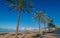 Mid morning sun on Ibiza waterfront. Warm sunny day along the beach in St Antoni de Portmany Balearic Islands, Spain