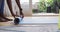 Mid section of african american woman rolling yoga mat at home