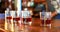 Mid section of barman serving whisky at bar counter