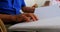 Mid section of blind senior man reading a braille book at nursing home 4k