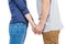 Mid section of couple holding hands