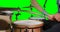 Mid section of drummer playing drum