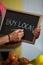 Mid section of male staff writing on slate board in organic section