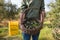 Mid section of man holding harvested olives in basket